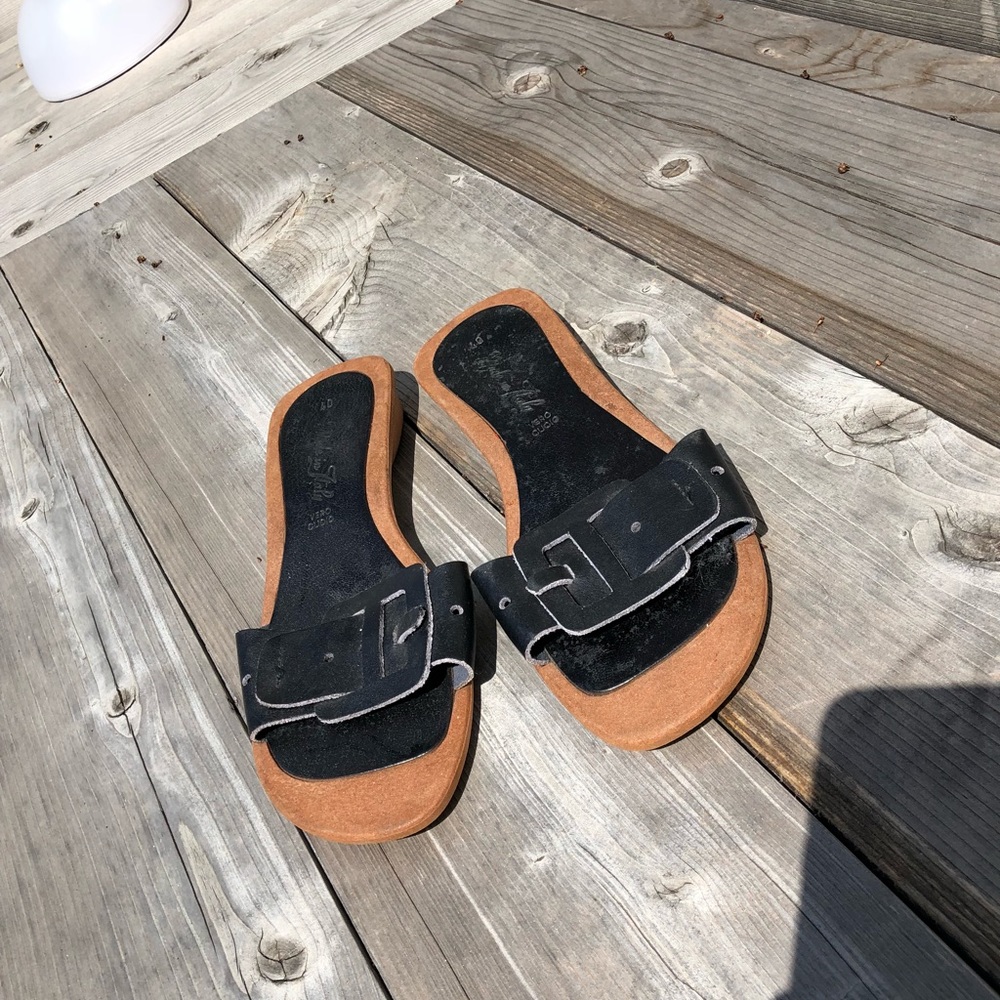 Leather slides made in Italy.